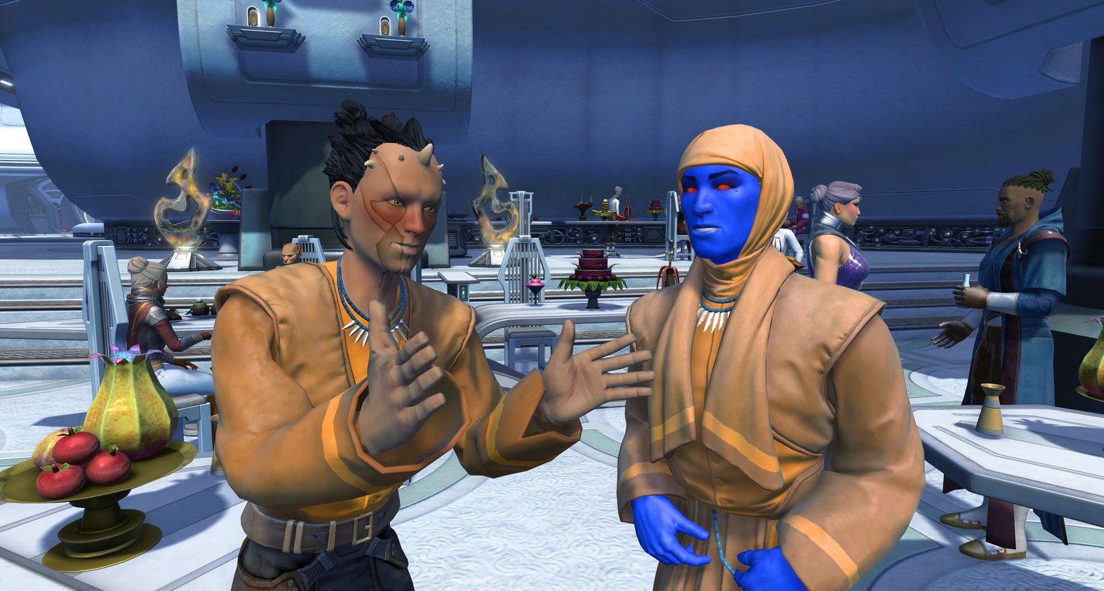 Two guests wearing the Feast Attendee robes at a banquet